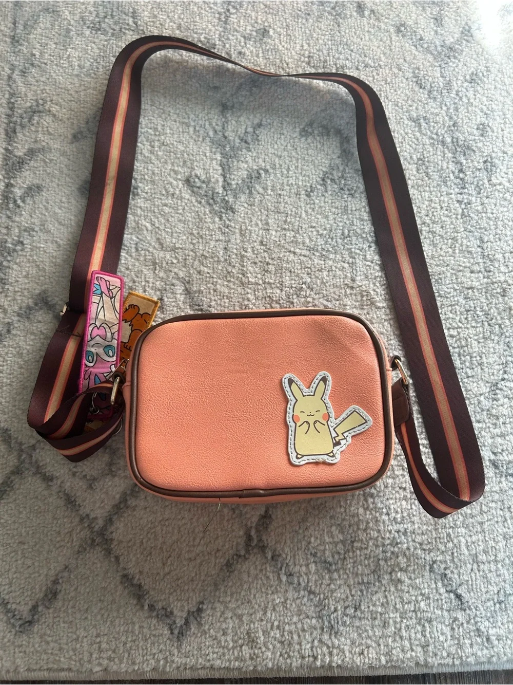 Bioworld Peach Crossbody Bag with Brown Stripe Strap